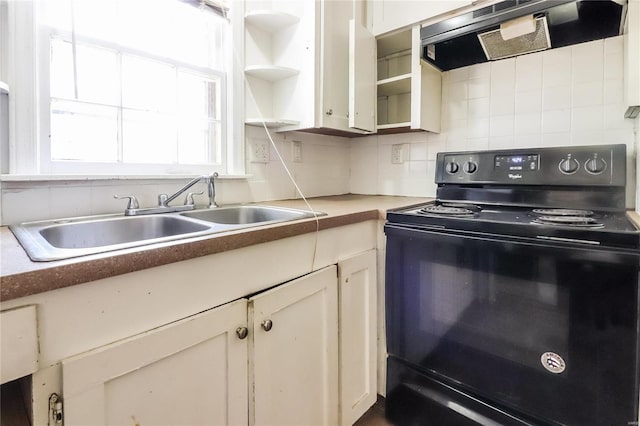 kitchen with ventilation hood, black electric range oven, sink, and decorative backsplash