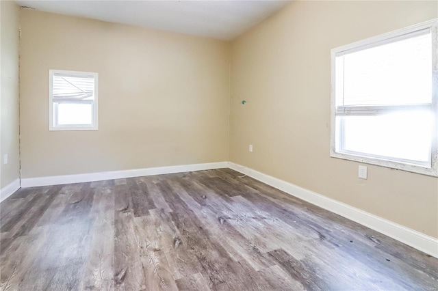 empty room with hardwood / wood-style floors