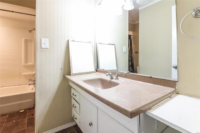 bathroom featuring tile patterned flooring, vanity, and bathing tub / shower combination