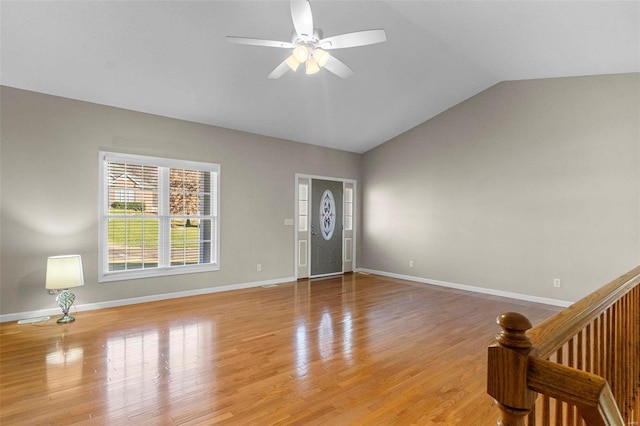 foyer with lofted ceiling, light hardwood / wood-style floors, and ceiling fan