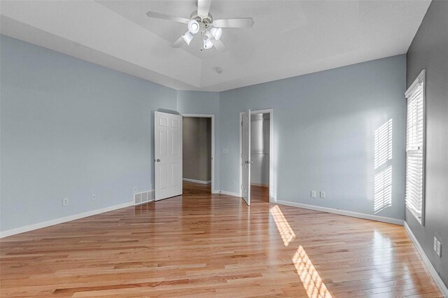 unfurnished room with ceiling fan and light hardwood / wood-style floors