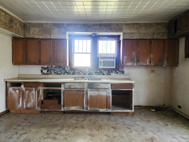 kitchen featuring sink and crown molding