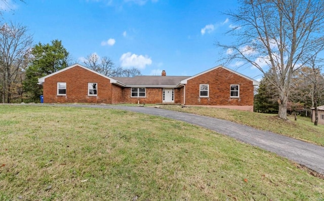 ranch-style home with a front yard