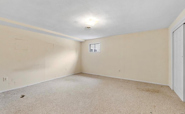 spare room with light carpet