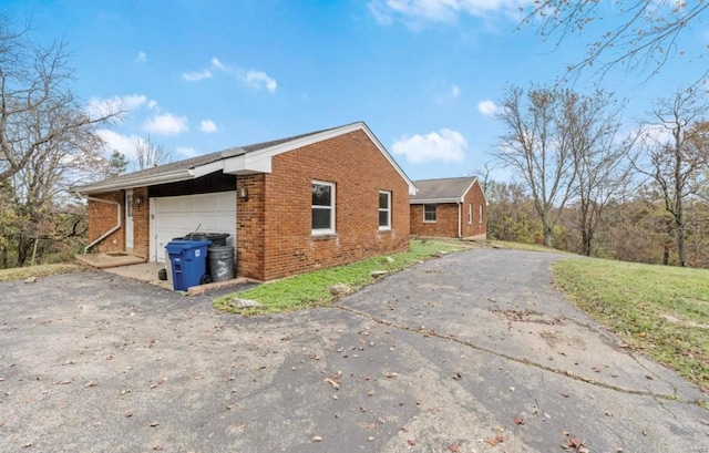 view of side of property featuring a garage