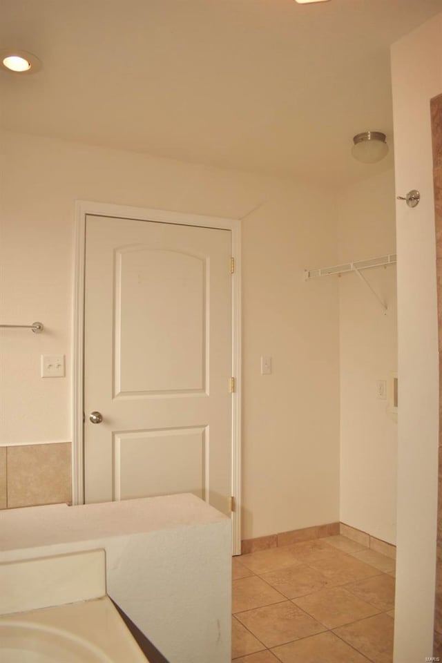 bathroom with tile patterned flooring