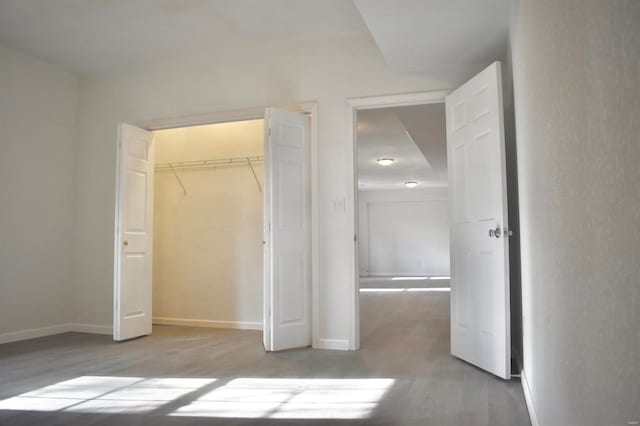 unfurnished bedroom with a closet