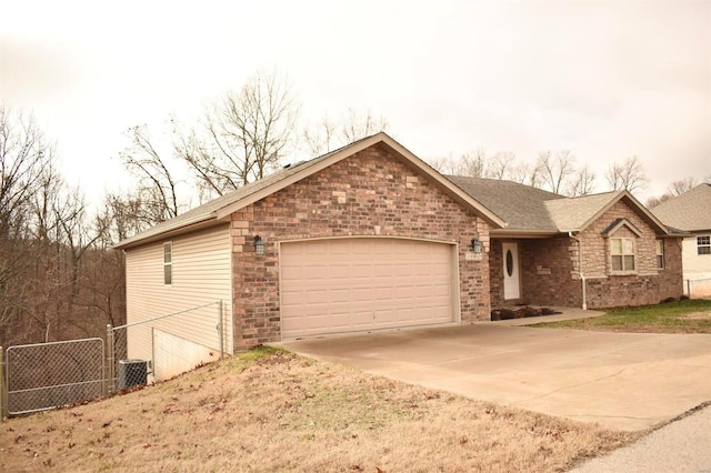 ranch-style home featuring a garage