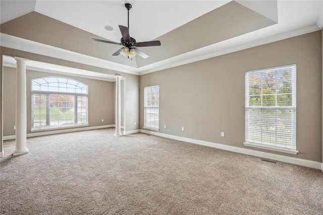 empty room with plenty of natural light, ceiling fan, and carpet floors