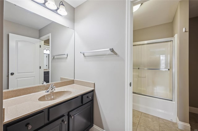 bathroom featuring shower / bath combination with glass door, tile patterned floors, and vanity