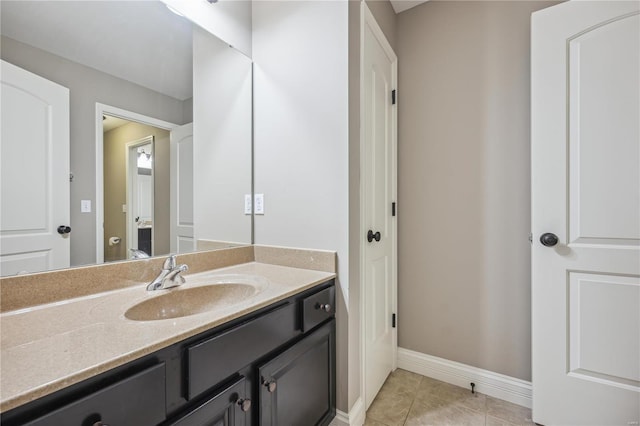 bathroom featuring tile patterned flooring and vanity