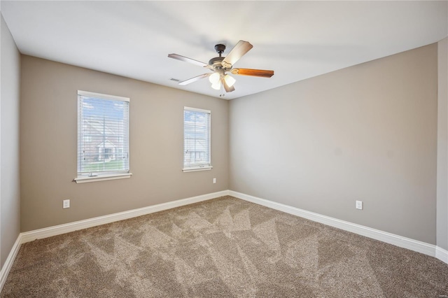 carpeted empty room with ceiling fan