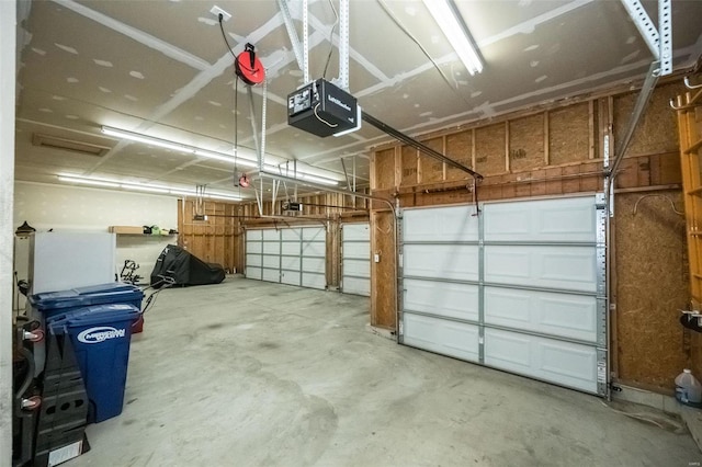 garage featuring a garage door opener