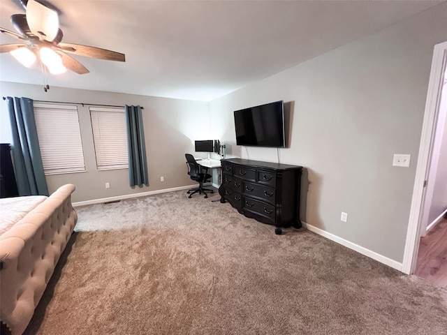 bedroom featuring ceiling fan and light carpet