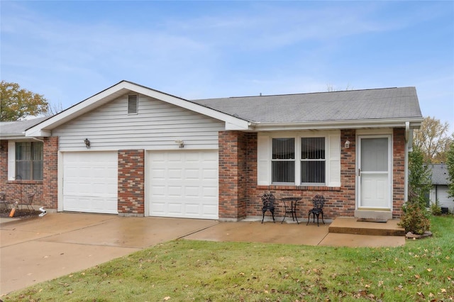 ranch-style home featuring a garage and a front yard