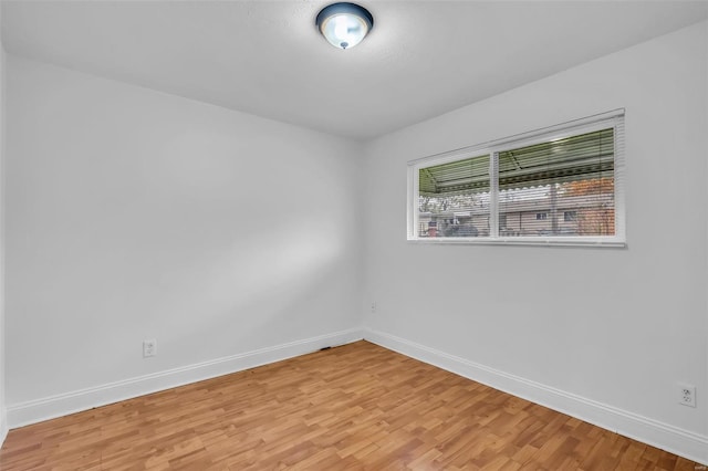 spare room featuring light hardwood / wood-style flooring