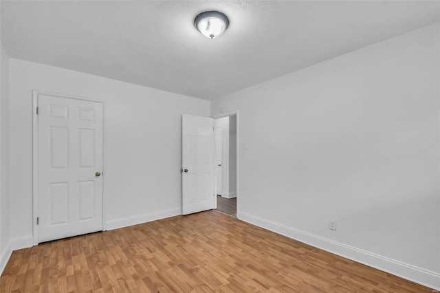 spare room with light wood-type flooring