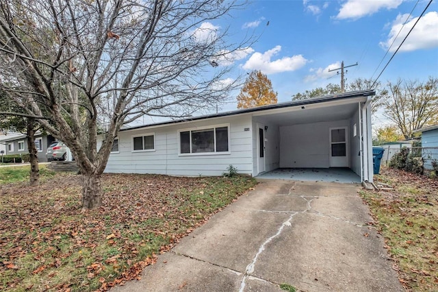 single story home with a carport