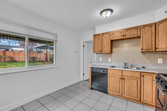 kitchen featuring backsplash, dishwasher, sink, and stainless steel gas range