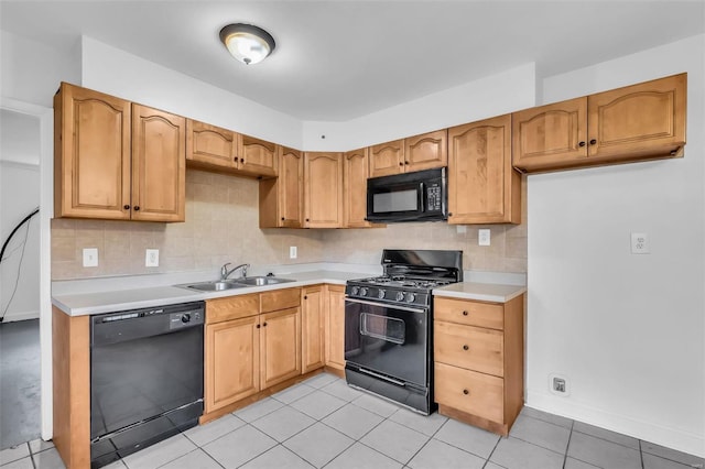 kitchen with black appliances, backsplash, light tile patterned floors, and sink