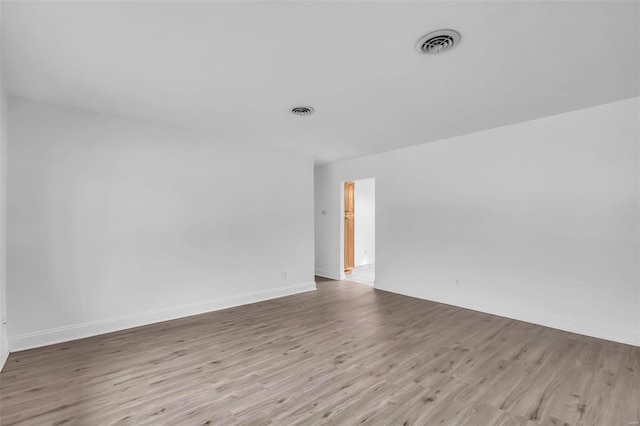 unfurnished room featuring light hardwood / wood-style floors