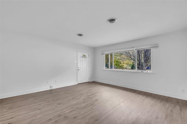 unfurnished room featuring hardwood / wood-style floors