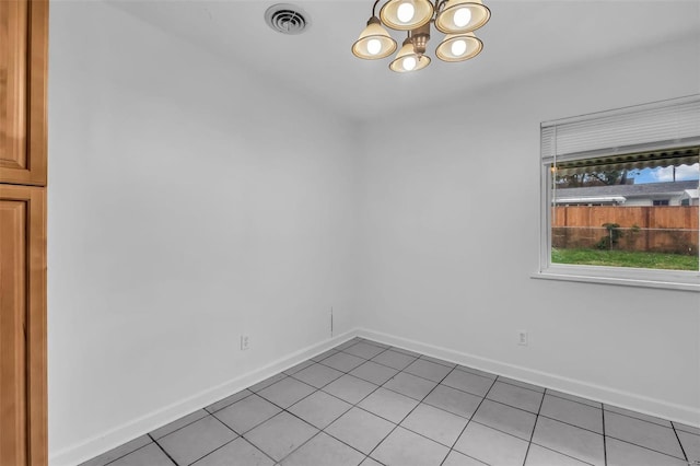 unfurnished room with light tile patterned flooring