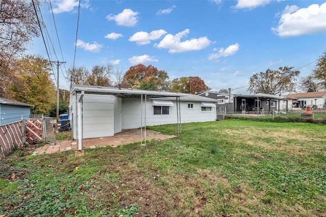 rear view of house with a yard