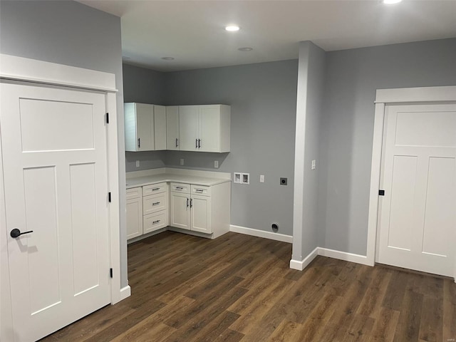 kitchen with white cabinets and dark wood-type flooring