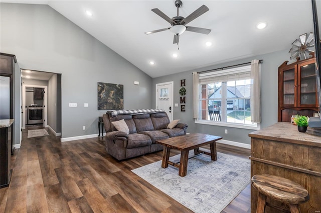 living room featuring high vaulted ceiling, dark hardwood / wood-style flooring, and ceiling fan