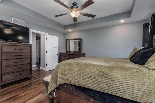 bedroom featuring dark hardwood / wood-style flooring and ceiling fan