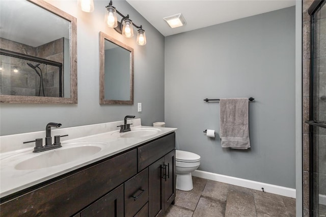 bathroom featuring walk in shower, vanity, and toilet