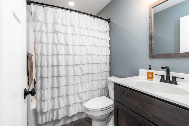 bathroom featuring vanity and toilet