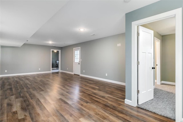 spare room featuring dark hardwood / wood-style flooring