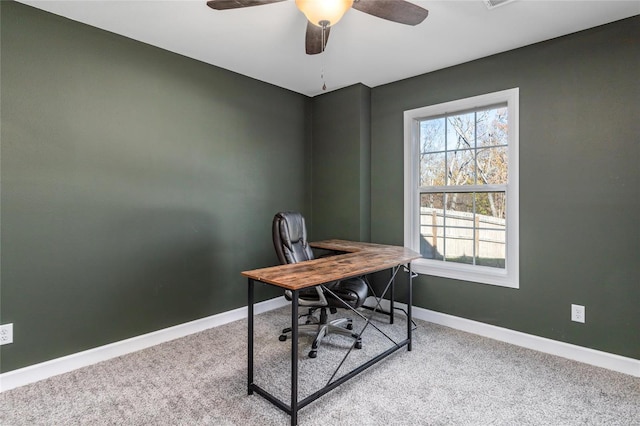 office space with light carpet and ceiling fan