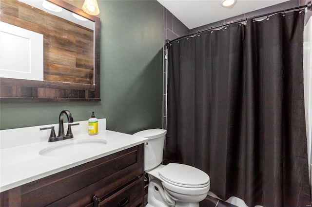 bathroom with toilet and vanity