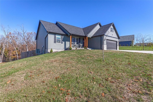 view of front of house with a garage and a front lawn