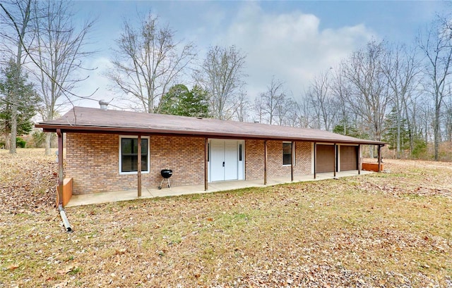 rear view of house featuring a patio area