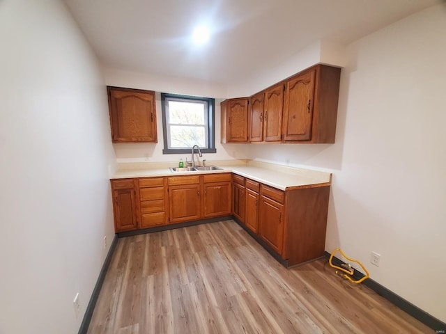 kitchen with sink and light wood-type flooring