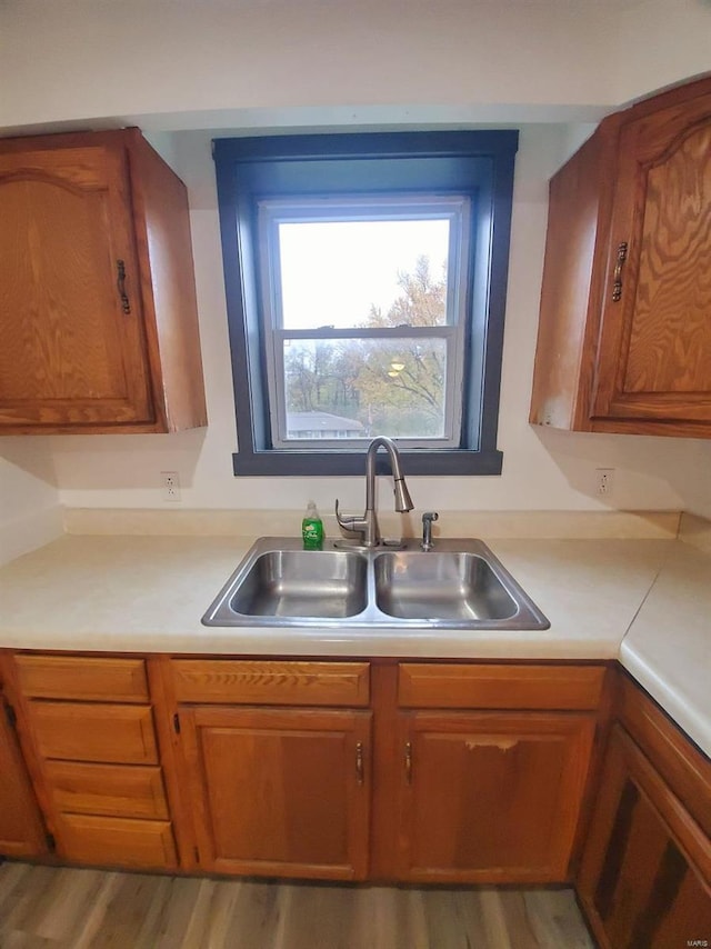 kitchen featuring sink and light wood-type flooring