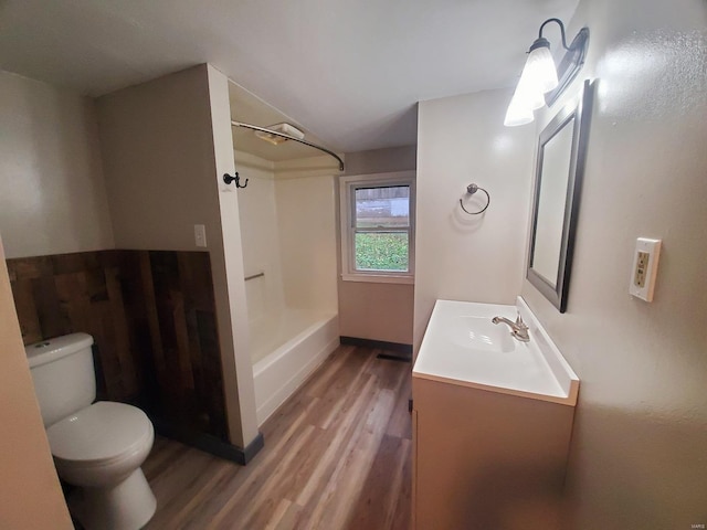 bathroom featuring wood-type flooring, vanity, and toilet