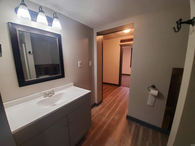 bathroom featuring hardwood / wood-style floors and vanity