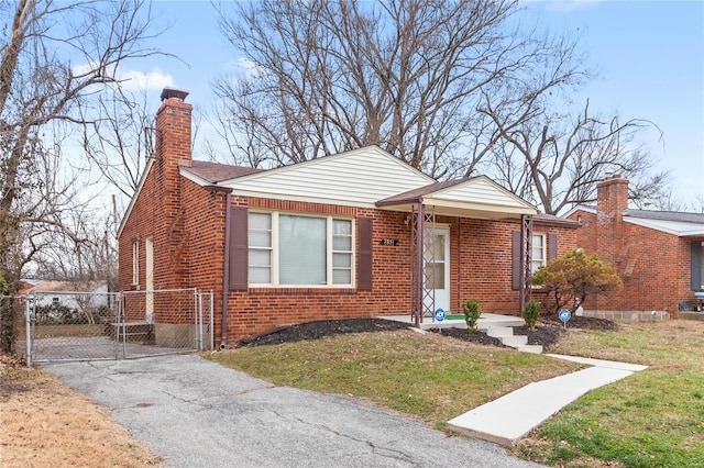 bungalow-style home with a front lawn