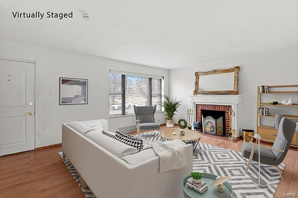 living room with a fireplace and hardwood / wood-style floors