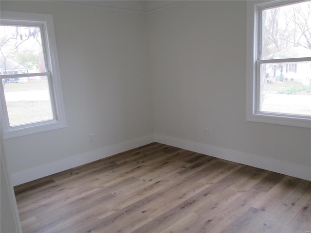 unfurnished room featuring light hardwood / wood-style floors