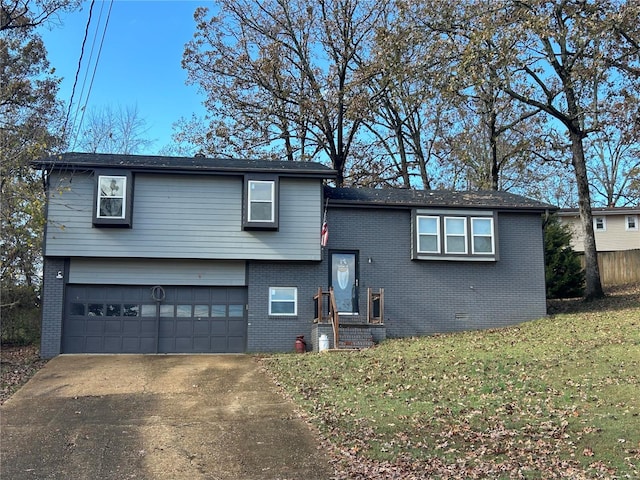 view of front of property with a garage and a front lawn