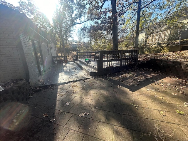 wooden deck with a patio area