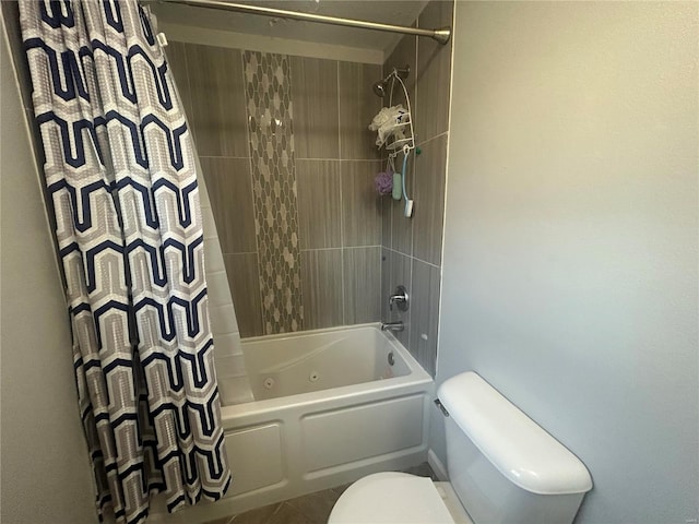 bathroom with shower / tub combo with curtain and toilet