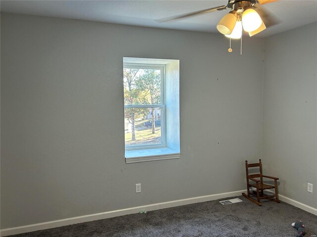 empty room with carpet and ceiling fan