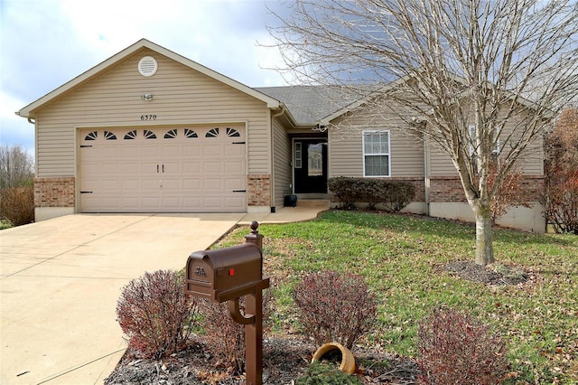 ranch-style house with a front yard and a garage